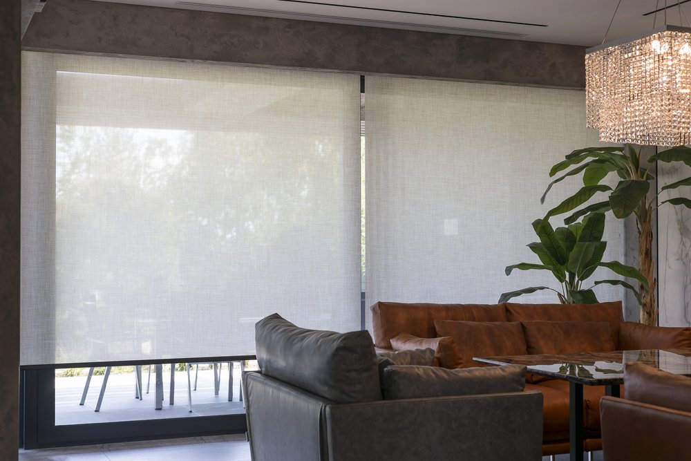 Motorized window shades in luxury living room