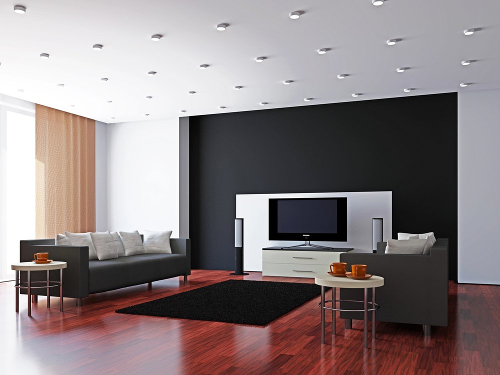 Modern living room with recessed lighting and mounted television