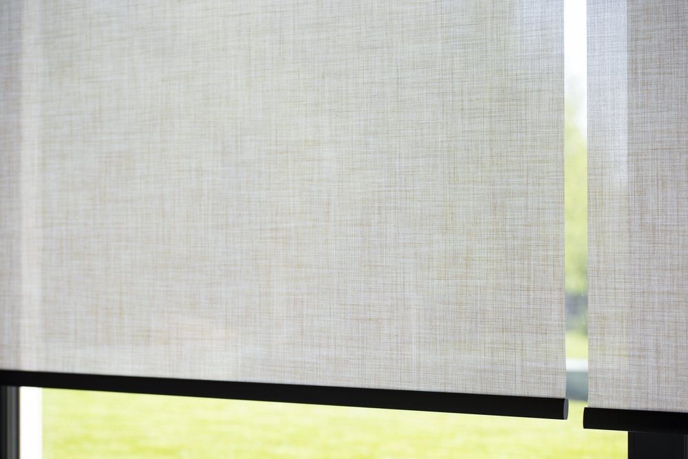 Close-up detail of motorized roller shade fabric texture