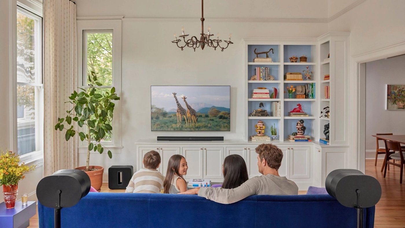 Family enjoying Sonos home theater system with Arc soundbar